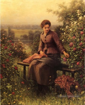 Daniel Ridgway Knight œuvres - Fille assise avec les fleurs de la paysanne Daniel Ridgway Knight